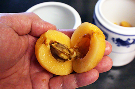 Loquat halves revealing seeds